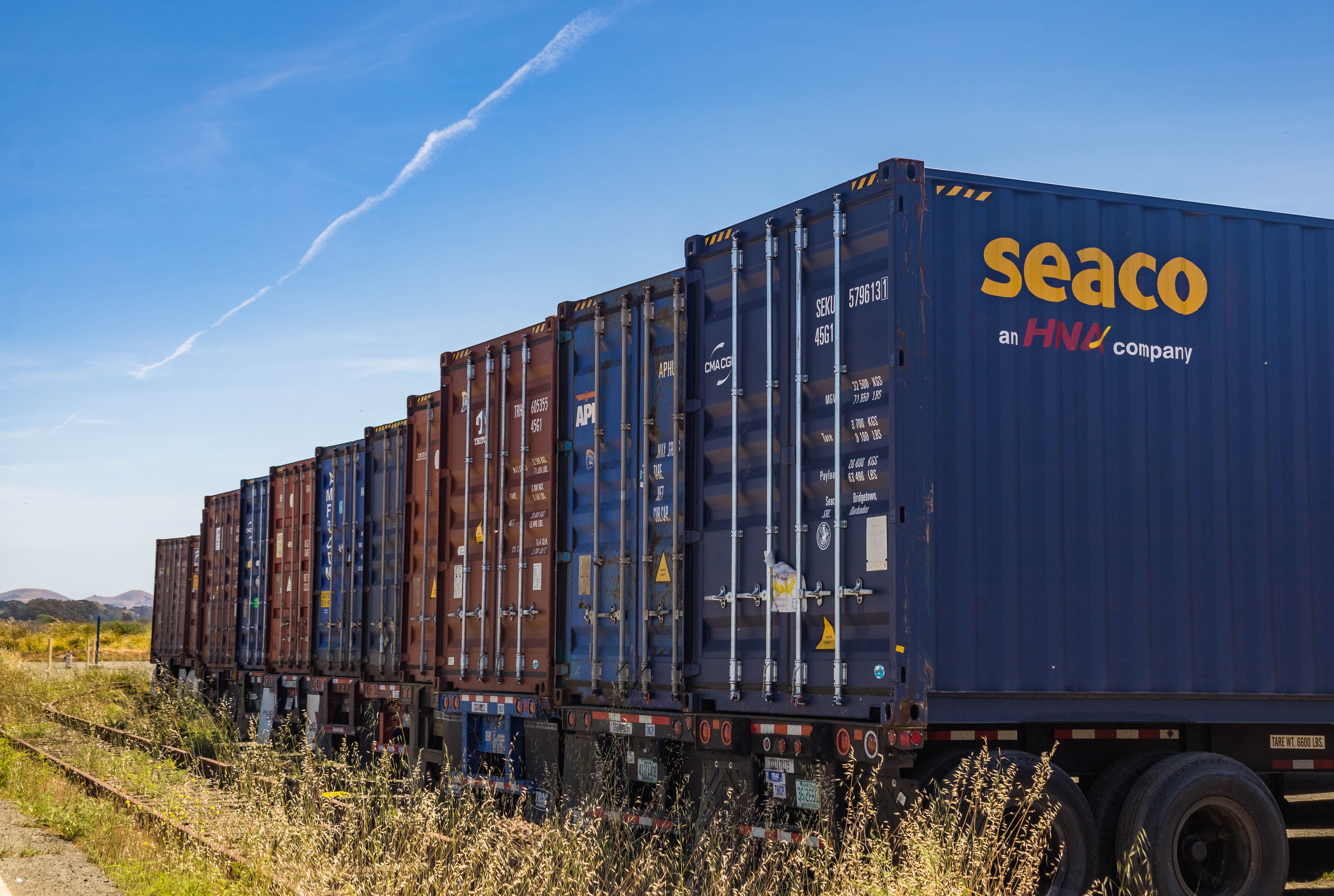 Freight trucks on highway delivering cargo across the nation